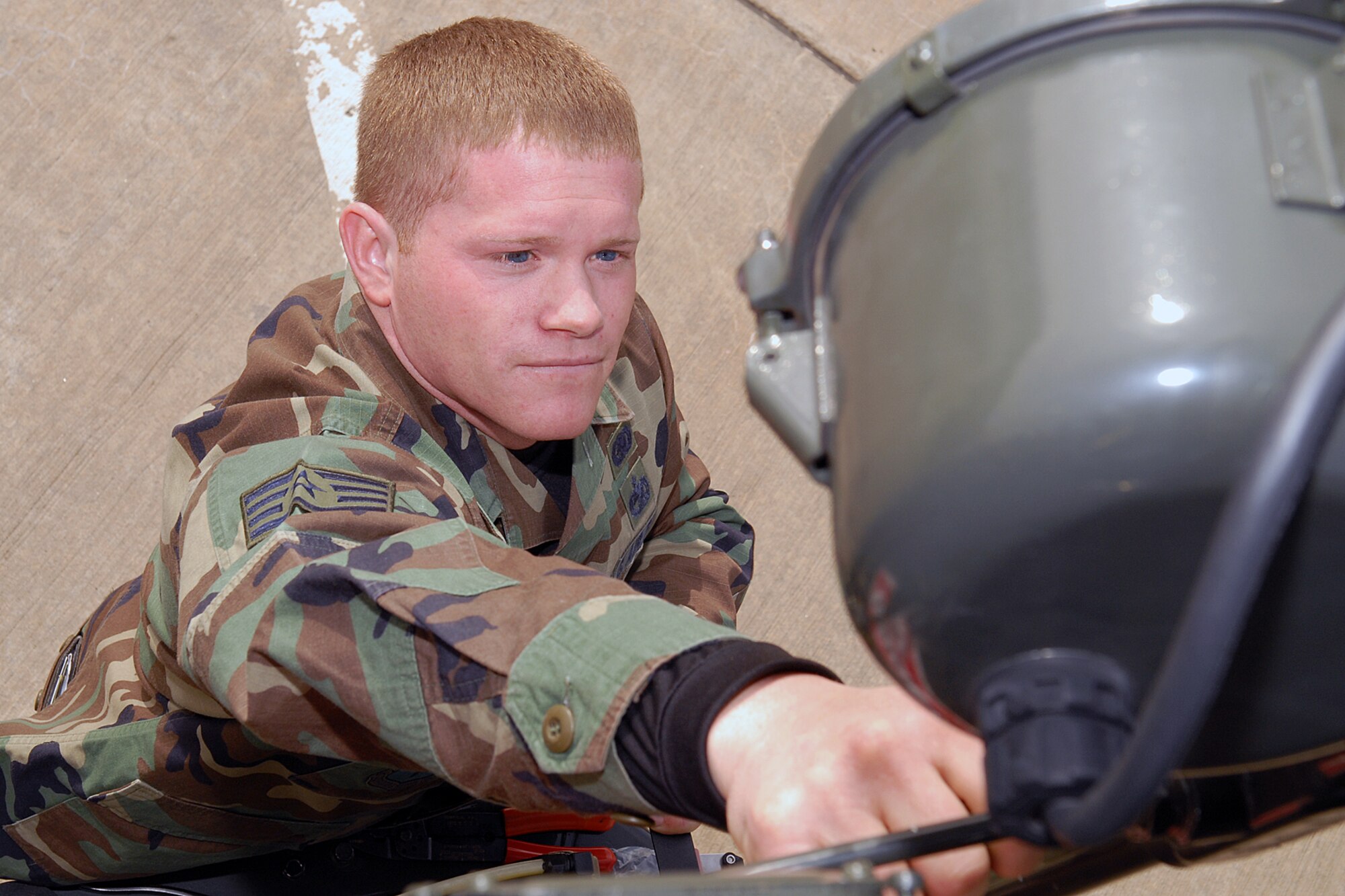 Staff Sergeant Justin Selepack, Refueling Maintenance Technician, 314th Logistics Readiness Squadron, replaces a Kovatch refueling truck spotlight switch at Little Rock Air Force Base on Jan. 24, 2007. The Fuels Management Flight was recently presented the Roy Bateman Award as best fuels flight in Air Education and Training Command. (U.S. Air Force photo by Airman 1st Class Nathan Allen) 