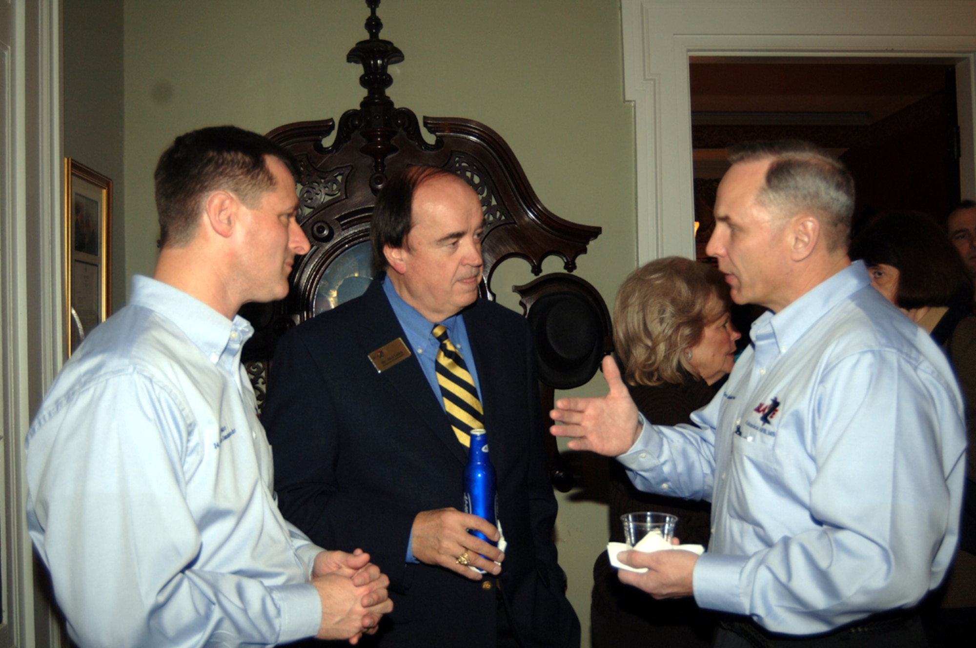 From left, Col. Mark Baker, 14th Flying Training Wing vice commander; Dick Leike, Crye-Leike Realty co-founder; and Maj. Gen. Mark Anderson, Installation Excellence Selection Team chief and mobilization assistant to the Deputy Chief of Staff Logistics, Installations and Mission Support, Headquarters U.S. Air Force, The Pentagon, speak Feb. 1 at the White Arches Home in Columbus.