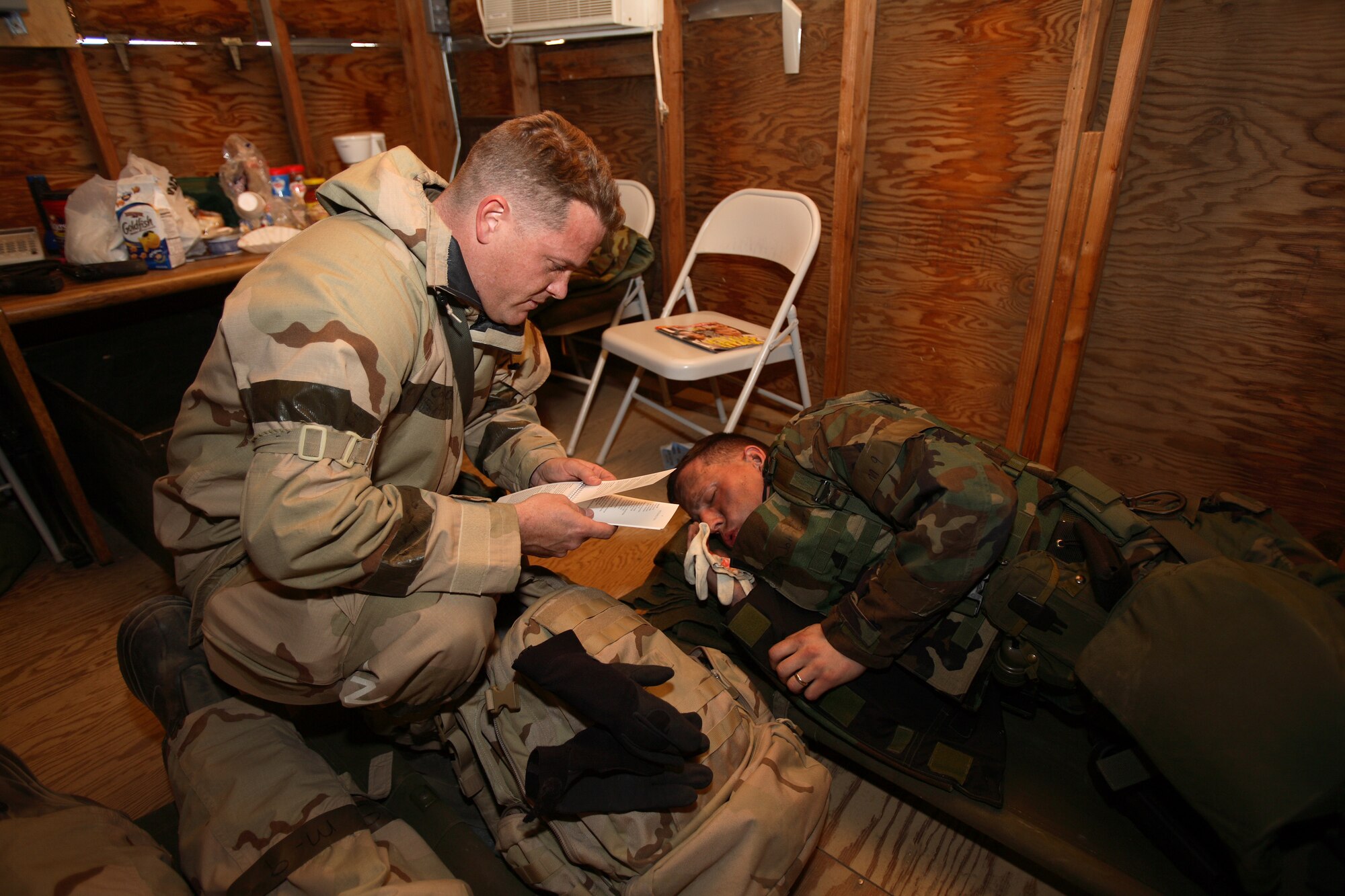 Chaplain (Capt.) Christopher Conklin, 95th Air Base Wing Chaplain Services, reads a "dead" Airman's last rites during the Phase II ORE. (Photo by Jet Fabara)