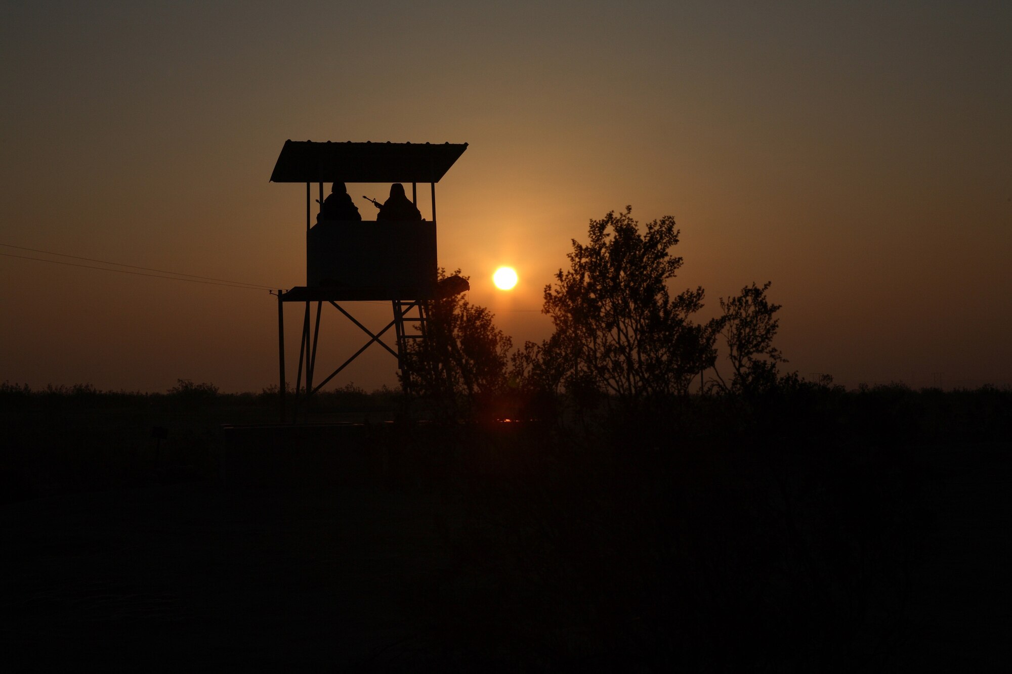 Airmen guard the perimeter of Camp Corum as the sun rises. (Photo by Jet Fabara)