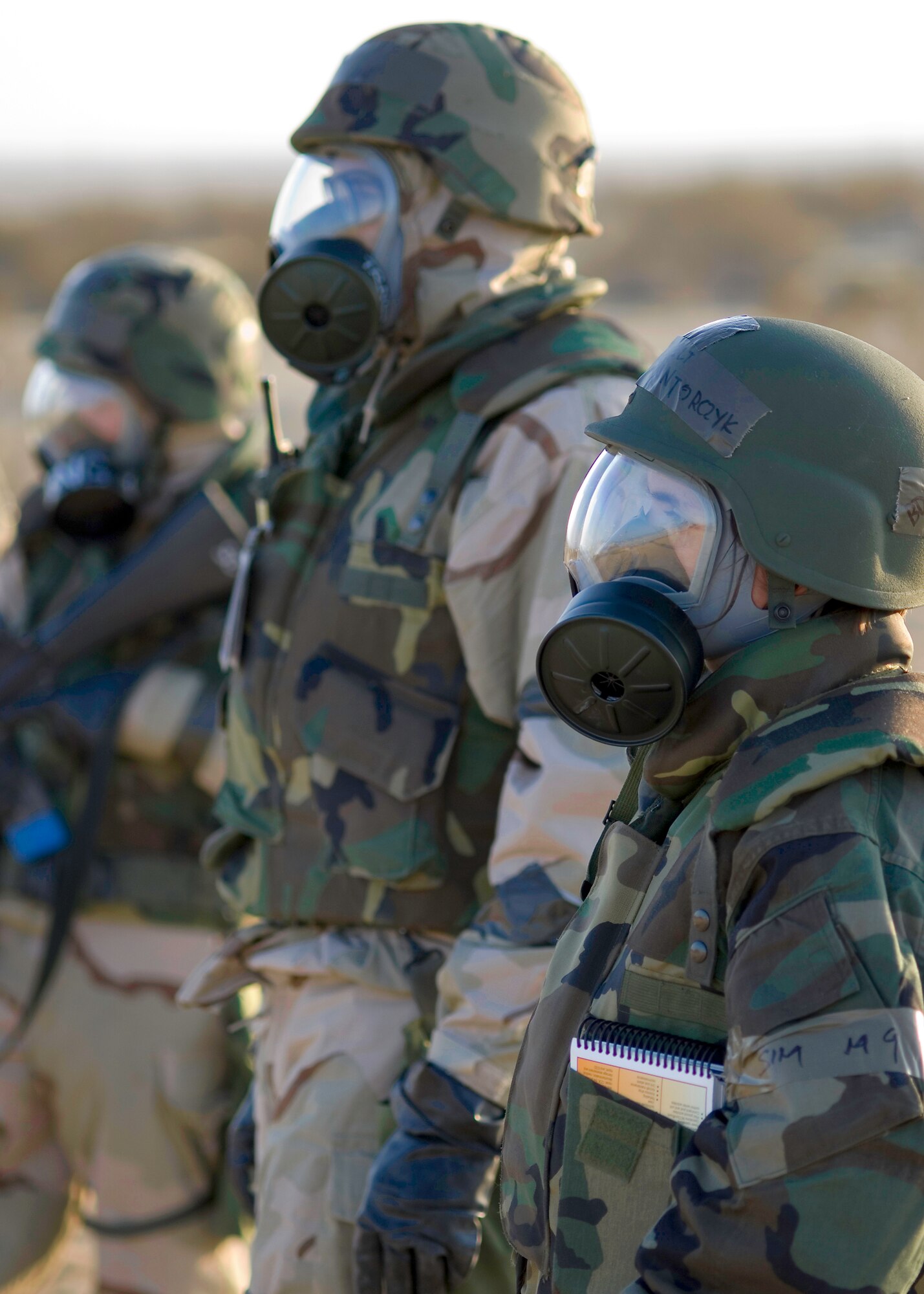 Airmen stand by for simulated unexploded ordnance sweeps. (Photo by Mike Cassidy)