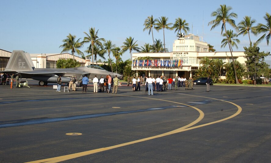 HICKAM AIR FORCE BASE, Hawaii -- Local civic leaders get a closer look at an F-22 here Feb. 8, 2007, while on its way to Kadena Air Base, Japan. The 27th Fighter Squadron, Langley Air Force Base, Va. are deploying 12 F-22s and more than 250 personnel overseas for the first time to Japan. (U.S. Air Force photo by Vanessa Perez) 