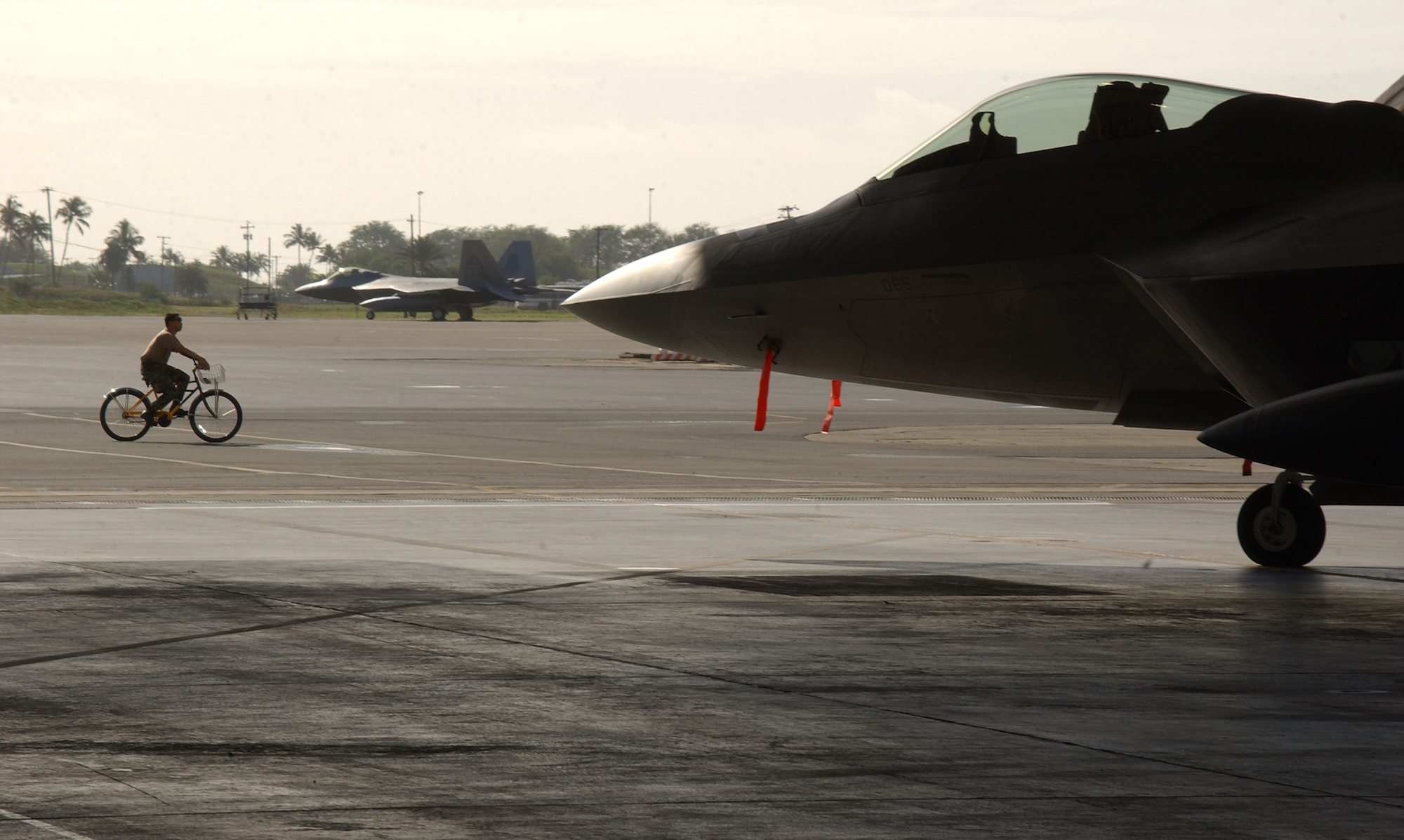 HICKAM AIR FORCE BASE, Hawaii -- An F-22 sits on the ramp here Feb. 8, 2007, while on its way to Kadena Air Base, Japan. The 27th Fighter Squadron, Langley Air Force Base, Va. are deploying 12 F-22s and more than 250 personnel overseas for the first time to Japan. (U.S. Air Force photo by Vanessa Perez) 