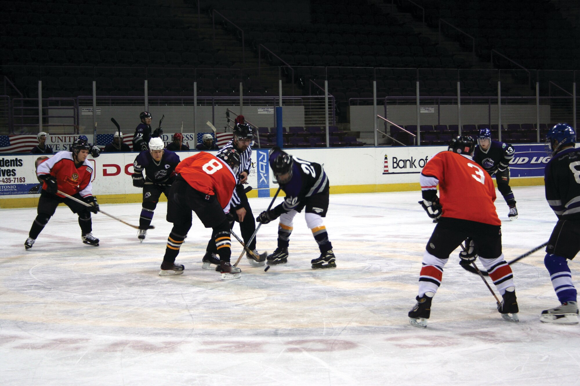 Zac Proano #8, Northwest Florida Hockey League Islanders, faces off against a member of the Stallions Monday night at the Pensacola Civic Center. (U.S. Air Force Photograph by Jamie Haig)