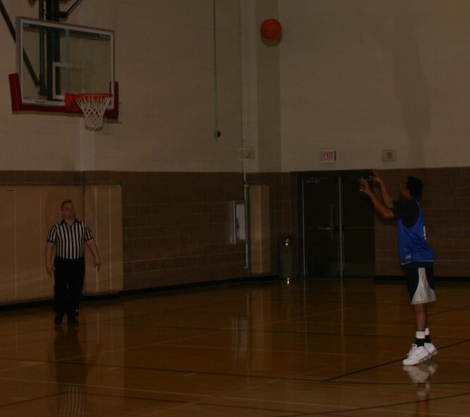 James Ellis of the 365th Training Squadron sinks one of his four successful free throw shots during the game against the 264th Medical Battalion.  The 264th won the game, 77-73. (U.S. Air Force Photo/Staff Sgt. Tonnette Thompson)