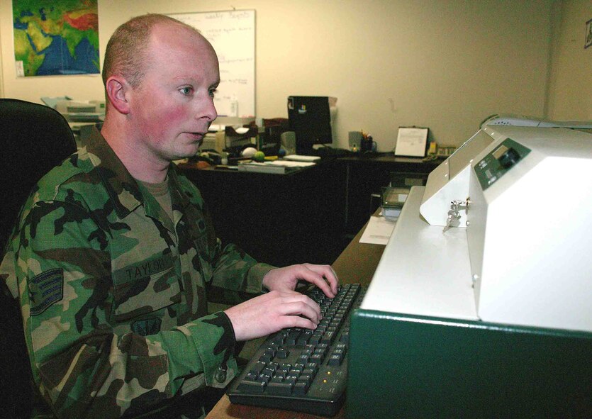 SHAW AIR FORCE BASE, S.C. -- Staff Sgt. David Taylor, 20th Mission Support Squadron personnel readiness technician, makes "dog tags" for a customer Jan. 31. (U.S. Air Force photo/Senior Airman John Gordinier)