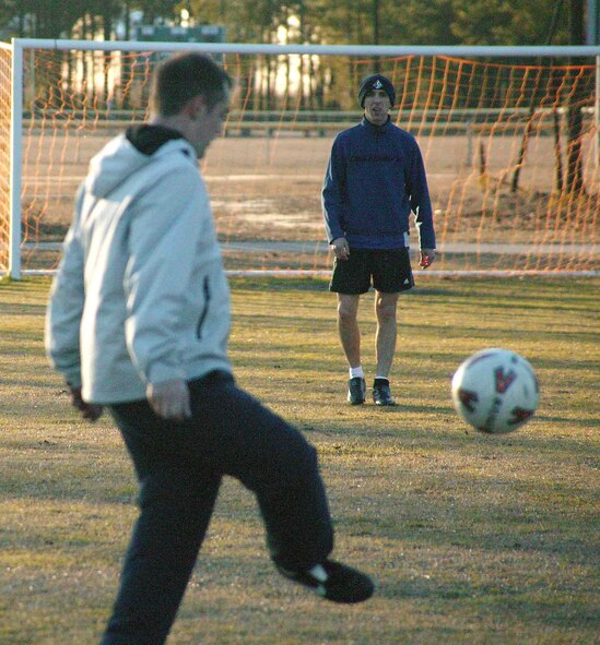 SHAW AIR FORCE BASE, S.C. -- Tech. Sgt. Greg Friend (left), 20th Equipment Maintenance Squadron, recieves the ball from Staff Sgt. Randy Kitzmiller, 20th EMS, during soccer practice Feb. 6 at the outdoor recreation sports complex. (U.S. Air Force photo/Senior Airman John Gordinier)