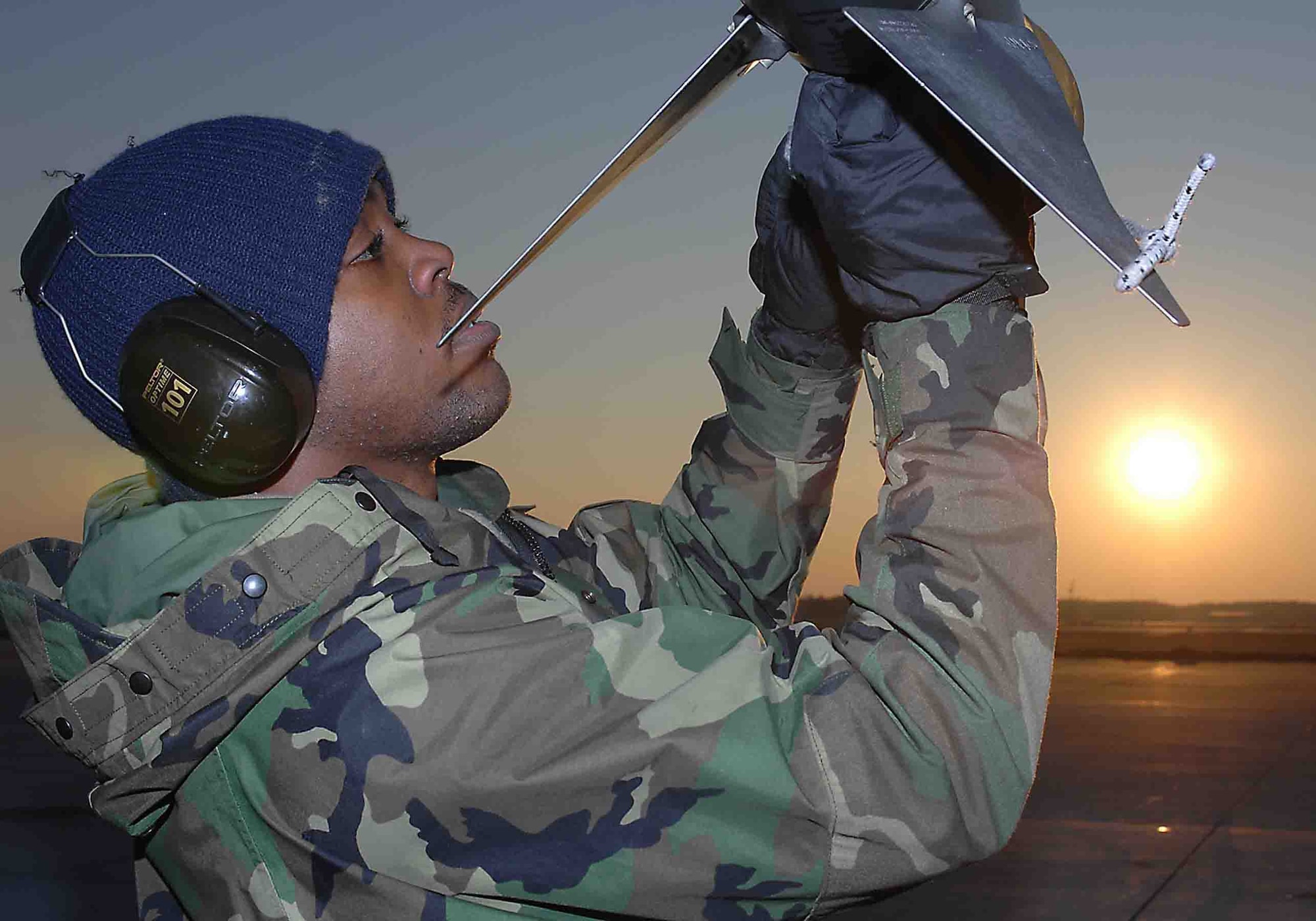 SHAW AIR FORCE BASE, S.C. -- Airman 1st Class Wilbert Dixon, 77th Aircraft Maintenance Unit aircraft armament systems journeyman, replaces the cooling component Argon on an AIM-9 missile Feb. 7 during the Operation Iron Thunder exercise. More than 100 aircraft participated in the four-day exercise. (U.S. Air Force photo/Airman 1st Class Matthew Davis)