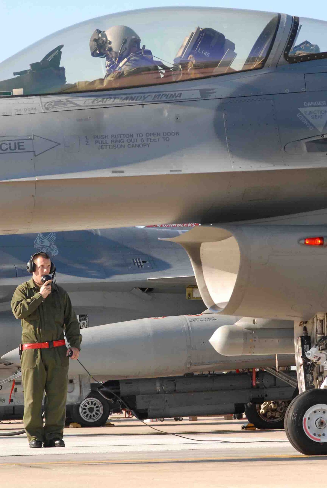 SHAW AIR FORCE BASE, S.C. -- Staff Sgt. Donald Slayton, 77th Fighter Squadron crew chief, performs a pre-flight inspection before launching an F-16CJ during the Operation Iron Thunder exercise Feb. 7. The four-day exercise prepares pilots for future contingency operations by exposing them to missions identical to those faced in combat. (U.S. Air Force Photo/Tech. Sgt. James Arrowood)