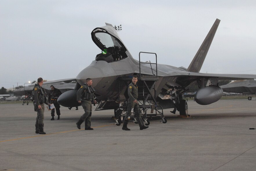 HICKAM AIR FORCE BASE, Hawaii -- The first F-22s arrived here Feb. 7, 2007, on their  way to Kadena Air Base, Japan. The 27th Fighter Squadron, Langley Air Force Base, Va. are deploying 12 F-22s and more than 250 personnel overseas for the first time to Japan. (U.S. Air Force photo by Vanessa Perez)  