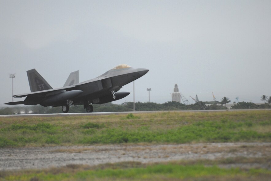 HICKAM AIR FORCE BASE, Hawaii -- The first F-22 lands here Feb. 7, 2007, on its way to Kadena Air Base, Japan. The 27th Fighter Squadron, Langley Air Force Base, Va. are deploying 12 F-22s and more than 250 personnel overseas for the first time to Japan. (U.S. Air Force photo by Vanessa Perez)  