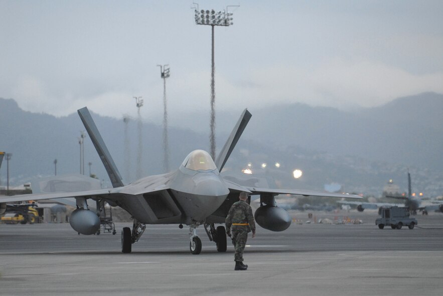 HICKAM AIR FORCE BASE, Hawaii -- The first F-22 lands here Feb. 7, 2007, on its way to Kadena Air Base, Japan. The 27th Fighter Squadron, Langley Air Force Base, Va. are deploying 12 F-22s and more than 250 personnel overseas for the first time to Japan. (U.S. Air Force photo by Vanessa Perez) 

