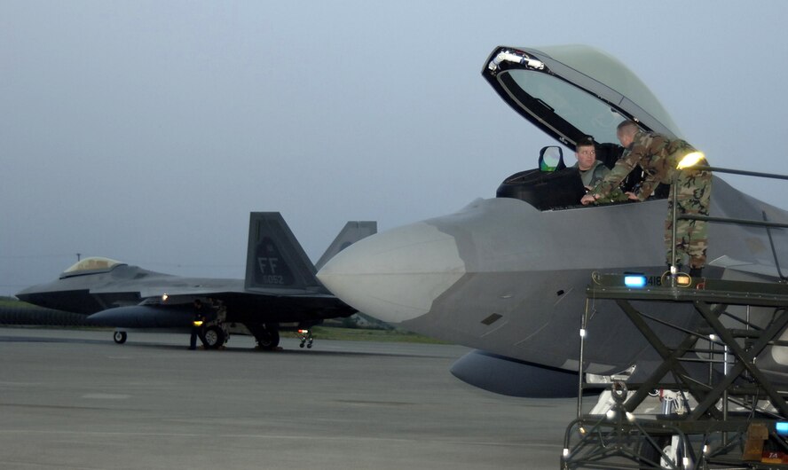 HICKAM AIR FORCE BASE, Hawaii -- The first F-22s arrive here Feb. 7, 2007, on their  way to Kadena Air Base, Japan. The 27th Fighter Squadron, Langley Air Force Base, Va. are deploying 12 F-22s and more than 250 personnel overseas for the first time to Japan. (U.S. Air Force photo by Vanessa Perez) 

