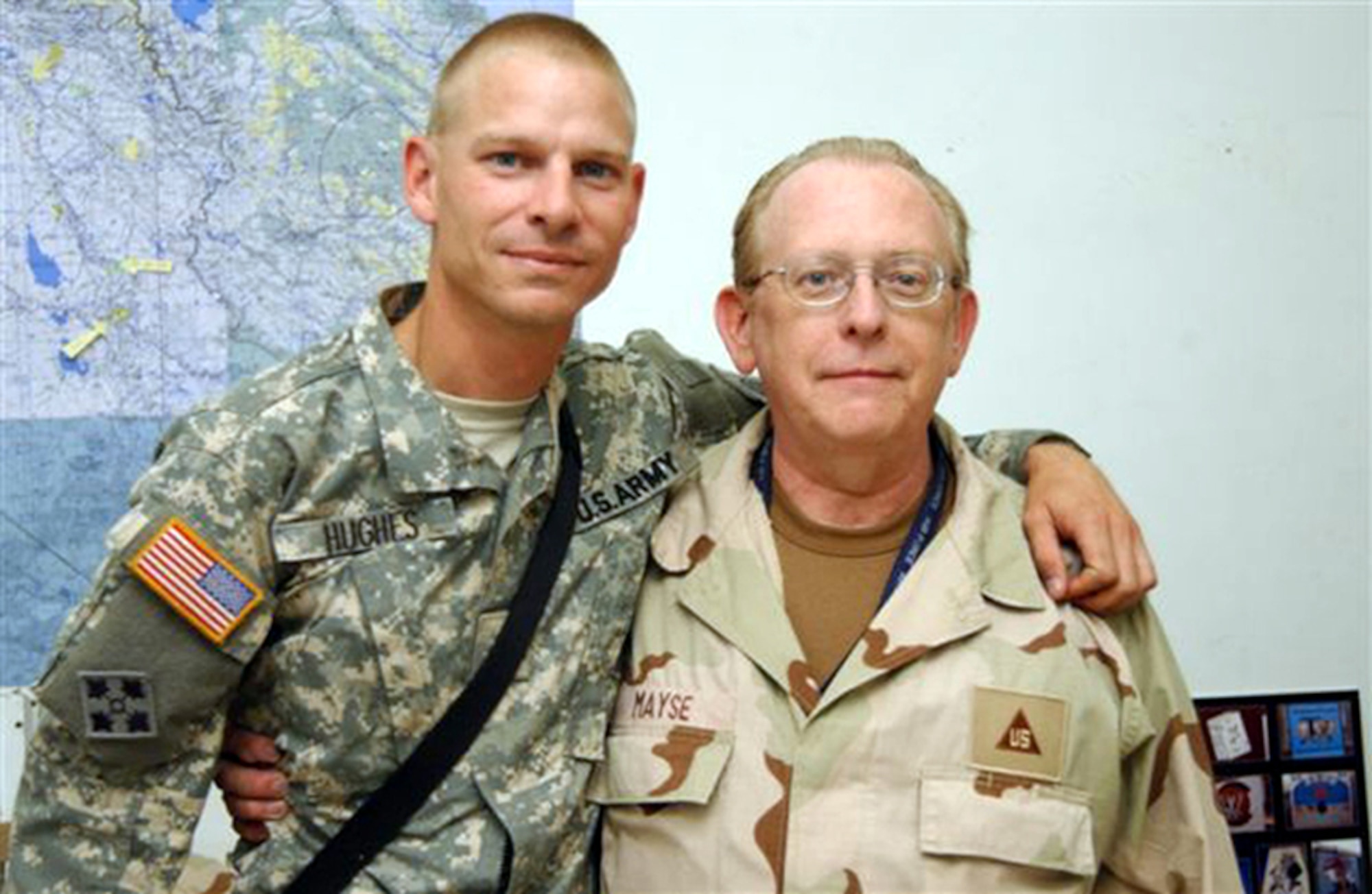 Army Sgt. Edward Hughes, a combat medic with the 5th Squadron, 73rd Cavalry Regiment Reconnaissance, 82nd Airborne Division, poses with his stepfather Chris Mayes, 9th Reconnaissance Wing historian, at Balad Air Base, Iraq. This picture was taken shortly before Sergeant Hughes was transported to Forward Operating Base Caldwell where his recovery vehicle was hit by an Improvised Explosive Device. (Courtesy photo)