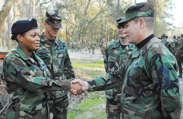 Chief Master Sgt. David Popp, Air Combat Command command chief master sergeant, greets Airman 1st Class Ava Turner, 822nd Security Forces Squadron, during his visit to Moody Tuesday and Wednesday. The chief visited numerous squadrons and spread his enthusiasm about the importance of Moody Airmen to the Air Force’s overall mission. (U.S. Air Force photo by Airman 1st Class Gina Chiaverottil)  
