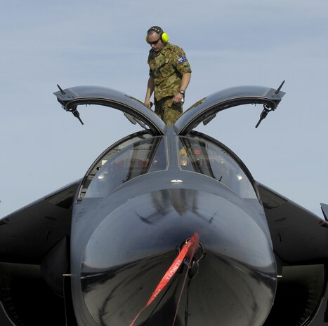 Royal Australian Air Force Corporal Lindsay Thurkettle, F-111 aircraft technician, performs a post-flight check after a Red Flag mission Feb. 6, 2007. Red Flag continues through Feb. 16 and is hosting the F-22 Raptor for the first time. Red Flag provides a highly realistic combat environment in which to train U.S. and allied aircrews. (U.S. Air Force photo/Staff Sgt. Kenny Kennemer)