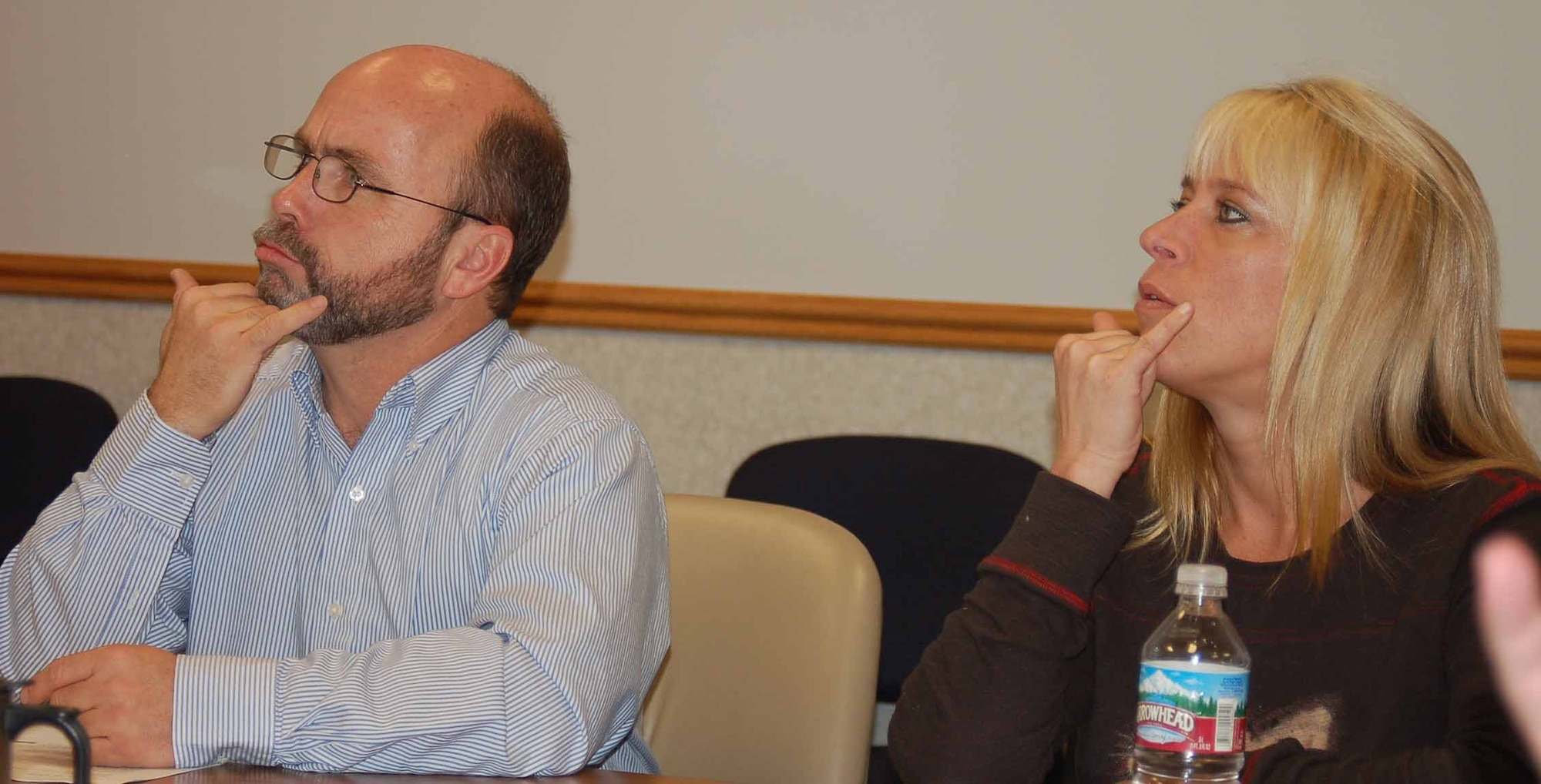 Class members Mike Cederquist and Wendy Monson practice the sign for "what's wrong" as part of a lesson on emergency sign language.