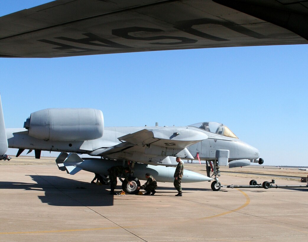 Airmen-in-training from the 362nd Training Squadron's Crew Chief course latch down an A-10 Thunderbolt II under the watchful eye of their instructor, Tech. Sgt. Brian Cruickshank, Feb. 7. (U.S. Air Force photo/Adrian McCandless)