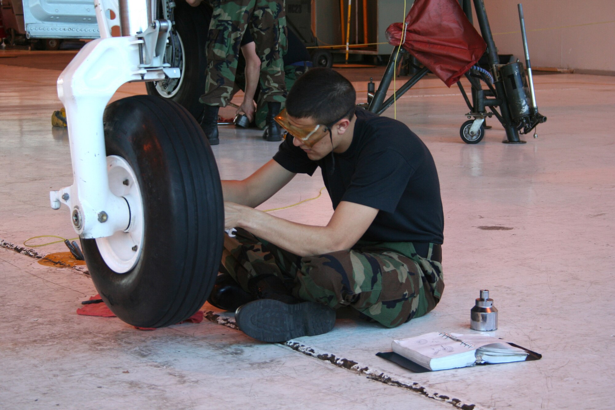 Airman 1st Class Nick Reedy, a crew chief-in-training at the 362nd Training Squadron, changes a tire on an A-10 Thunderbolt II Feb 7. (U.S. Air Force photo/Adrian McCandless)