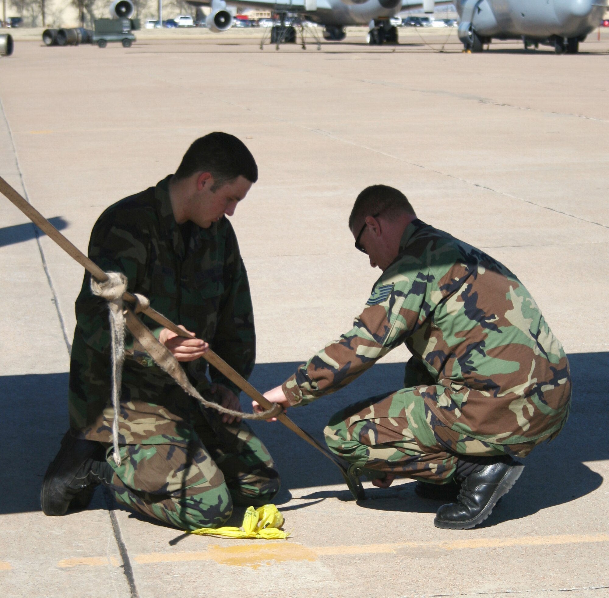 Tech. Sgt. Brian Cruickshank shows Airman Chad Whitney, of the 362nd Training Squadron crew chief course, how to properly latch down an A-10 Thunderbolt II Feb. 7. (U.S. Air Force photo/Adrian McCandless)