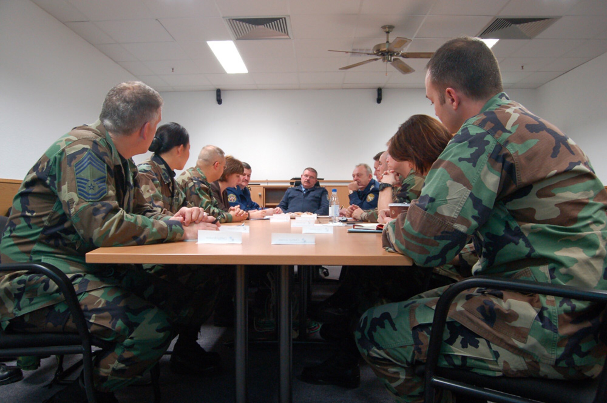 Members of the 52nd Logistics Readiness Squadron discuss the unit’s mission with four visiting Ukrainian armed forces force logistics officers. (US Air Force photo by Staff Sgt. Tammie Moore)