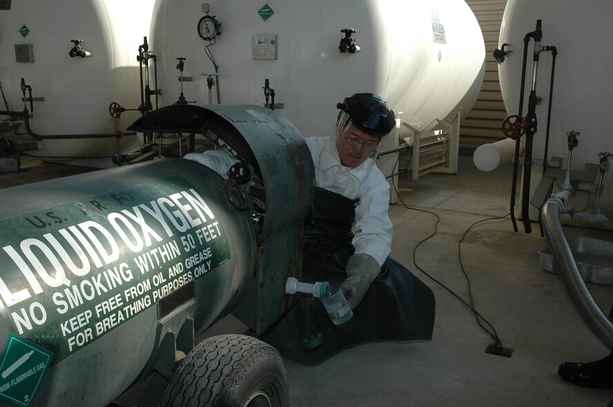 OSAN AIR BASE, Republic of Korea --  Mr. Yi, Myong Son, 51st Logistics Readiness Squadaron fueling unit operator, is pouring a sample of liquid oxygen into a beaker to begin quality assurance testing. Liquid oxygen is tested frequent to ensure the highest quality product is used for Osan. (U.S. Air Force photo by 2nd Lt. Kim Schaerdel)