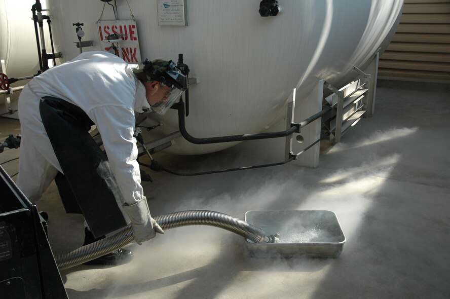 OSAN AIR BASE, Republic of Korea --  Staff Sgt. Donald Scott, 51st Logistics Readiness Squadron bulk storage attendant, pours LOX from a 50-gallon LOX cart. (U.S. Air Force photo by 2nd Lt. Kim Schaerdel)