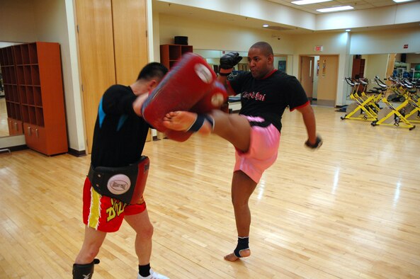 OSAN AIR BASE, Republic of Korea --  Johnathan Lytle spars with his instructor, Master Chae, Kim Myong at the Osan Fitness Center Thursday. (U.S. Air Force photo by Senior Airman Brok McCarthy)
