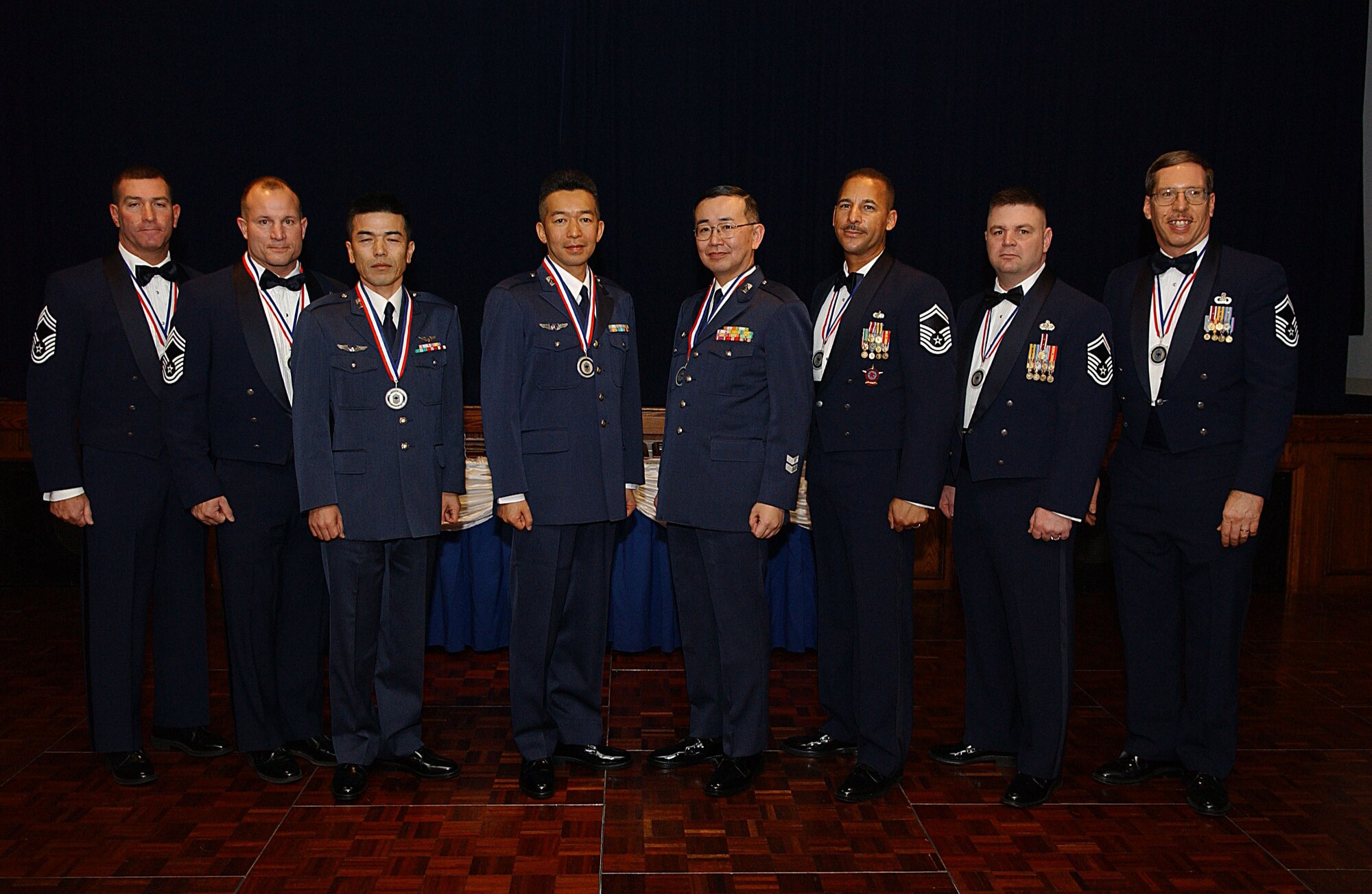 YOKOTA AIR BASE, Japan -- The following chiefs and chief selects were inducted at a ceremony Feb. 2. Left to right: Chief Master Sergeants Scott Cornell, 374th Civil Engineer Squadron; Howard Heisey, 374th Logistics Readiness Squadron, Akihiko Ishibashi, Japan Air Self Defense Force Signal Intercept Squadron, Hiroshi Kurakata, Ichigaya Air Station, Air Staff Office training section; Osamu Otaki, HQ Air Intelligence Wing, Fuchu Air Base; and Senior Master Sergeants Michael Breazell, PACAF Air Postal Squadron; Charles Funkhouser, 374 CES and Eric Strohecker, USAF Band of the Pacific-Asia. (U.S. Air Force photo by Airman 1st Class John Albea)                            