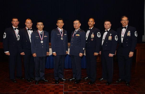 YOKOTA AIR BASE, Japan -- The following chiefs and chief selects were inducted at a ceremony Feb. 2. Left to right: Chief Master Sergeants Scott Cornell, 374th Civil Engineer Squadron; Howard Heisey, 374th Logistics Readiness Squadron, Akihiko Ishibashi, Japan Air Self Defense Force Signal Intercept Squadron, Hiroshi Kurakata, Ichigaya Air Station, Air Staff Office training section; Osamu Otaki, HQ Air Intelligence Wing, Fuchu Air Base; and Senior Master Sergeants Michael Breazell, PACAF Air Postal Squadron; Charles Funkhouser, 374 CES and Eric Strohecker, USAF Band of the Pacific-Asia. (U.S. Air Force photo by Airman 1st Class John Albea)                            