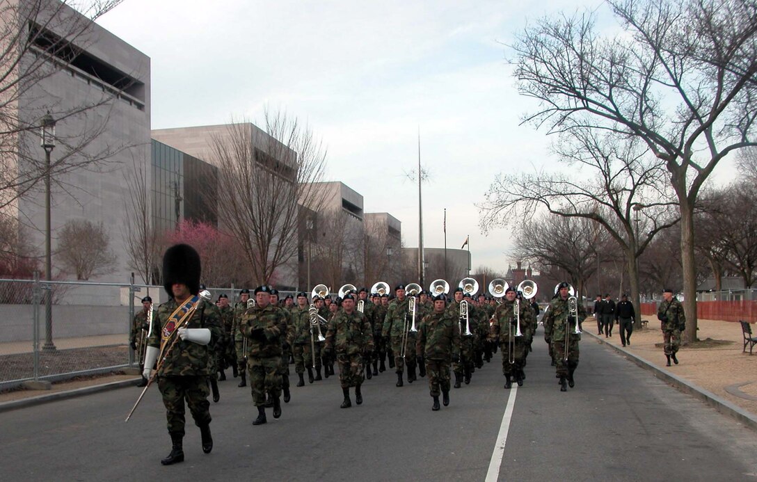 Army Master Sgt. William Gabbard, drum major for the Army Band,  leads the band down 4th Street to Pennsylvania Avenue during a Jan. 16  rehearsal for President Bush's inauguration parade. The Army band and marching  units will provide the lead division in the parade Jan. 20. Photo by Sgt. 1st  Class Doug Sample