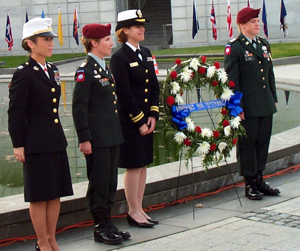 Wreath-laying participants are, left to right, Capt Linda D.  Philipp of the Marine Corps Recruiting Command, Quantico (Va.) Marine Base;  Army Capt. Kellie McCoy of the 82nd Airborne Division's 307th Engineer  Battalion; Navy Lt. Paula Godes, a physical therapist aboard the USNS Comfort;  and Army Capt. Betsy Hove of the 82nd Airborne Division's 307th Engineer  Battalion. Photo by Rudi Williams