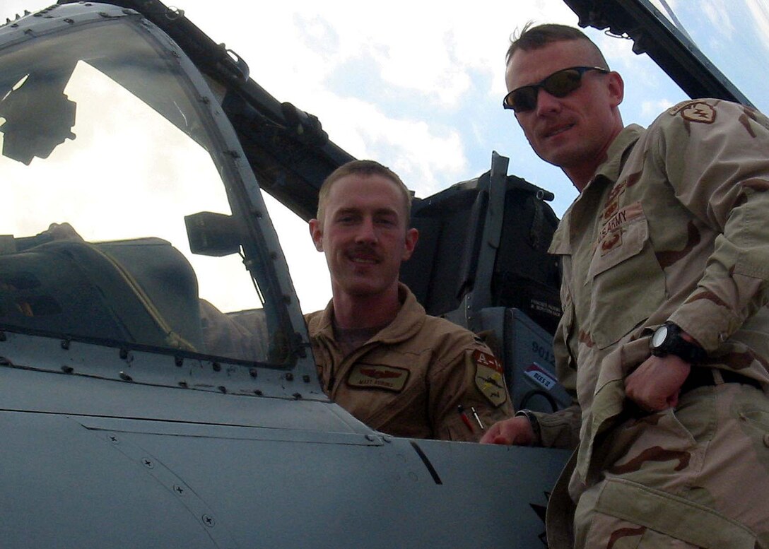 Air Force 1st Lt. Matt Robins (left), an A-10 pilot with the 
455th Expeditionary Fighter Squadron, deployed from Spangdahlem Air Base, 
Germany, poses with his brother, Army Capt Steven Robins, a member of 2nd 
Battalion, 27th Infantry regiment, deployed from Schofield Barracks, Hawaii, 
before taking off on a flight over Afghanistan. Photo by 2nd Lt. Michael 
Sheley, USAF