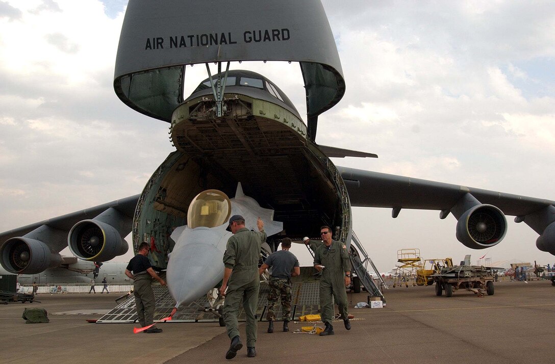 Members of the 174th Fighter Wing from Syracuse, N.Y., load 
their aircraft on a C-5 Galaxy in preparation for a return flight home to the 
United States after a weeklong participation at the South African Aerospace 
Exhibition at Waterkloof Air Force Base, Pretoria. Photo by Sgt. Matthew 
Johnson, USA