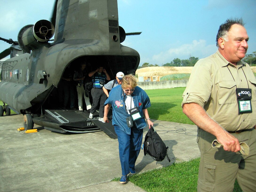 Civilian business, civic and academic leaders step off a CH-47  Chinook helicopter after arriving at Yongsan Garrison in Seoul, Korea, Sept.  13. Photo by Donna Miles