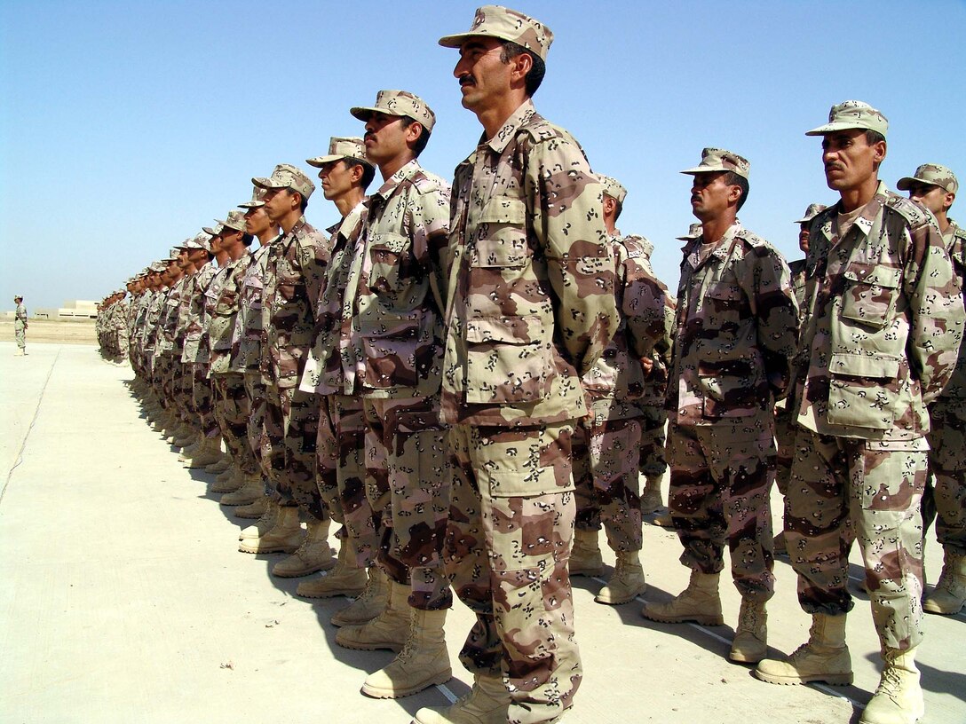 Soldiers From The Iraqi Army Stand Ready For Inspection During The Flag 