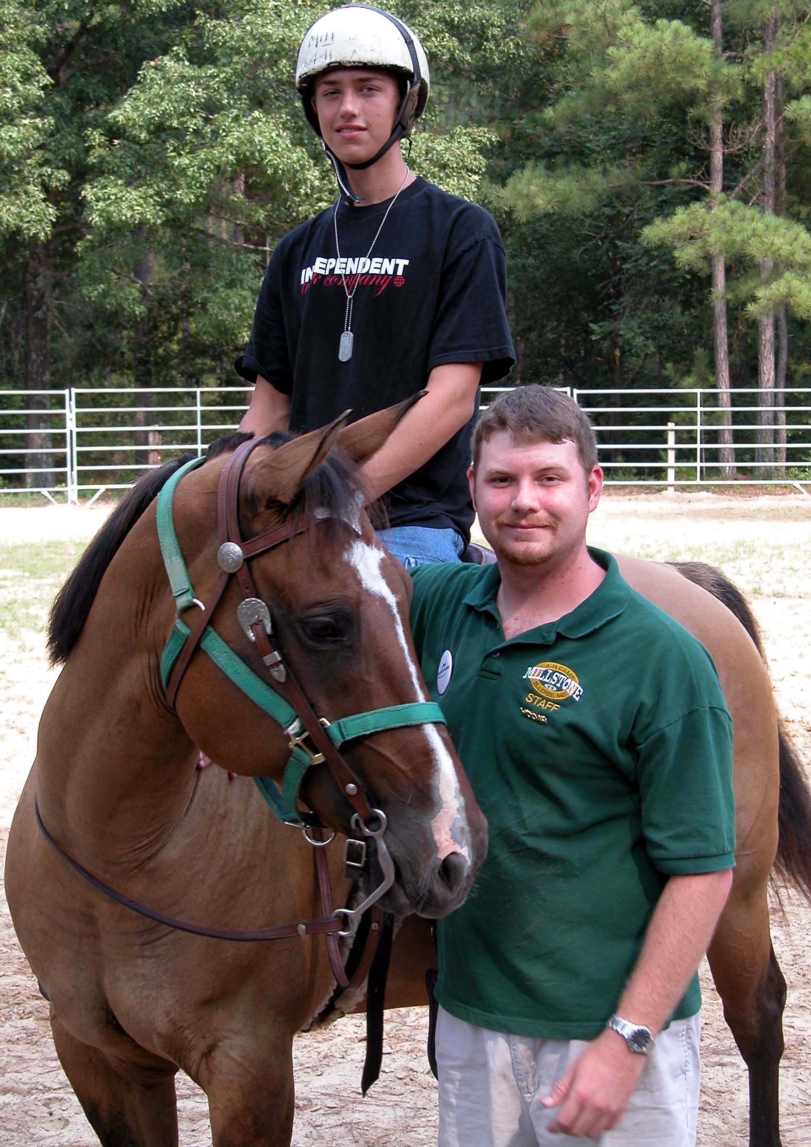 Jonathan Leist, 15, is mounted on "Dumpling," a quarter horse, as camp