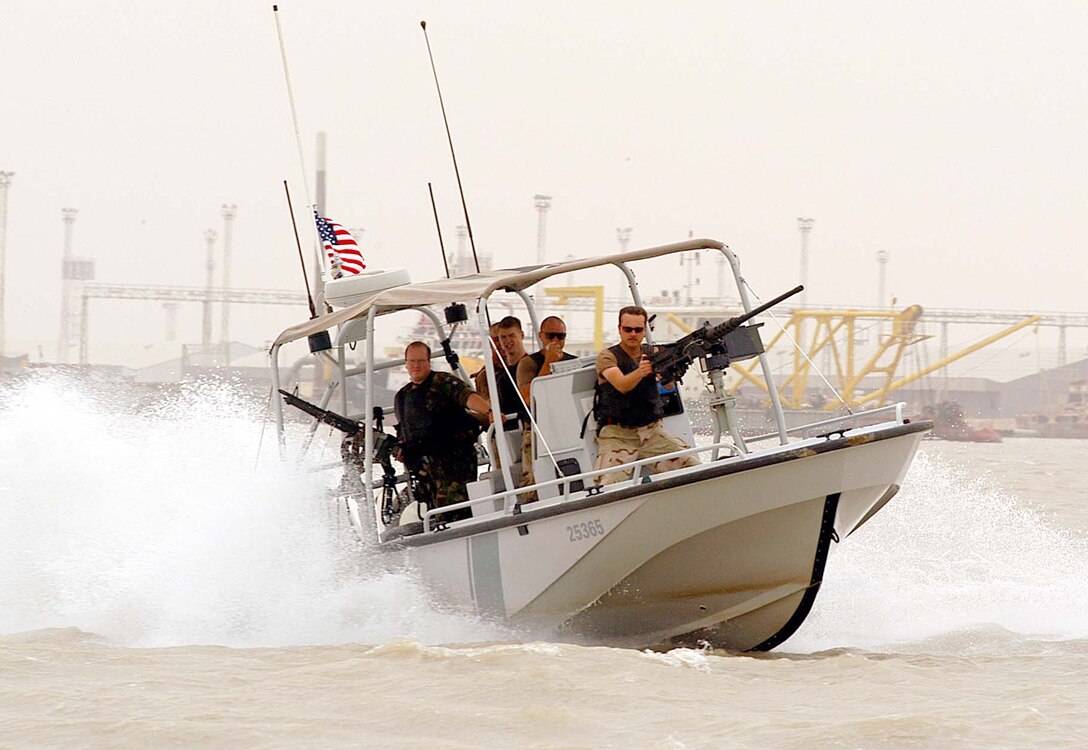Members of Coast Guard Port Security Unit 313, homeported in 
San Pedro, Calif., patrol the port of Umm Quasr, Iraq, during the major-combat 
phase of Operation Iraqi Freedom. Coast Guard port-security units helped 
maintain security in Iraqi ports and on oil terminals. Photo by Petty Officer 
1st Class Tom Sperduto, USCG