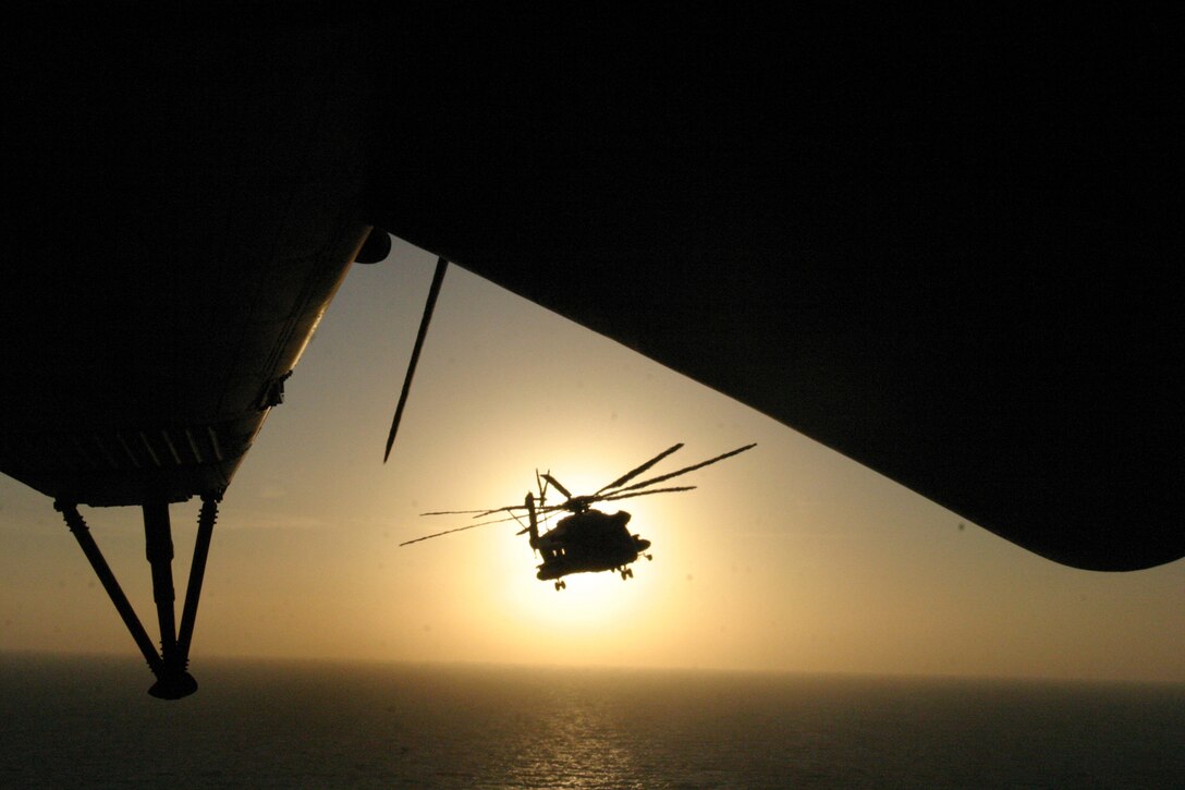 A CH-53E Super Stallion helicopter from Marine Medium Helicopter Squadron-264 (Reinforced), 26th Marine Expeditionary Unit, conducts an aerial live-fire exercise over the Indian Ocean Feb. 9, 2007. The MEU was supporting maritime security operations in the U.S. Naval Forces Central Command area of operations aboard the ships of the Bataan Expeditionary Strike Group.  (Official USMC photo by Gunnery Sgt. Clark J. Schindler) (Released)::n::