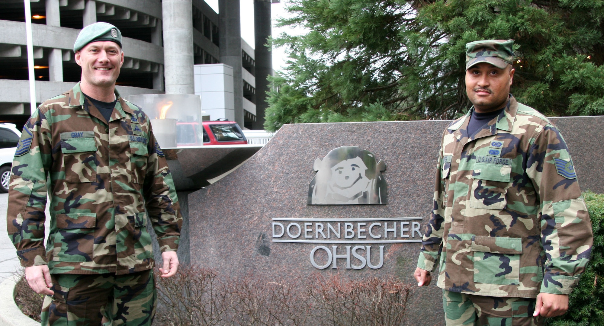 Master Sgt. Charles Gray, Survival, Evasion, Resistance and Escape instructor (left) and Tech. Sgt. Bryan Lopes pose for a photo at the Doernbecher Children's Hospital, Portland, Ore. Feb 7 where they gave aircrew from the Pediatric and Neonatal Transport Team also referred as the PANDA team a four hour survival training class.  (U.S. Air Force Photo/Master Sgt. Ruby Zarzyczny)
