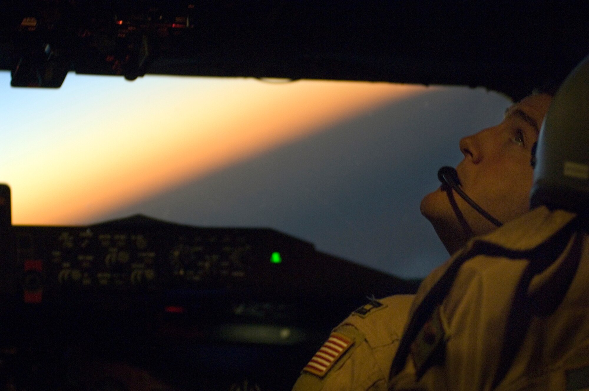 Capt. James Post performs his co-pilot duties in a KC-135 Stratotanker while refueling an F-16 Fighting Falcon over Iraq in support of Operation Iraqi Freedom. On Jan. 29, U.S., French and Royal Air Force tankers flew 25 sorties and off-loaded almost 1.6 million pounds of fuel in support of OIF and Operation Enduring Freedom. (U.S. Air Force photo/Tech. Sgt. Cecilio M. Ricardo Jr.) 
