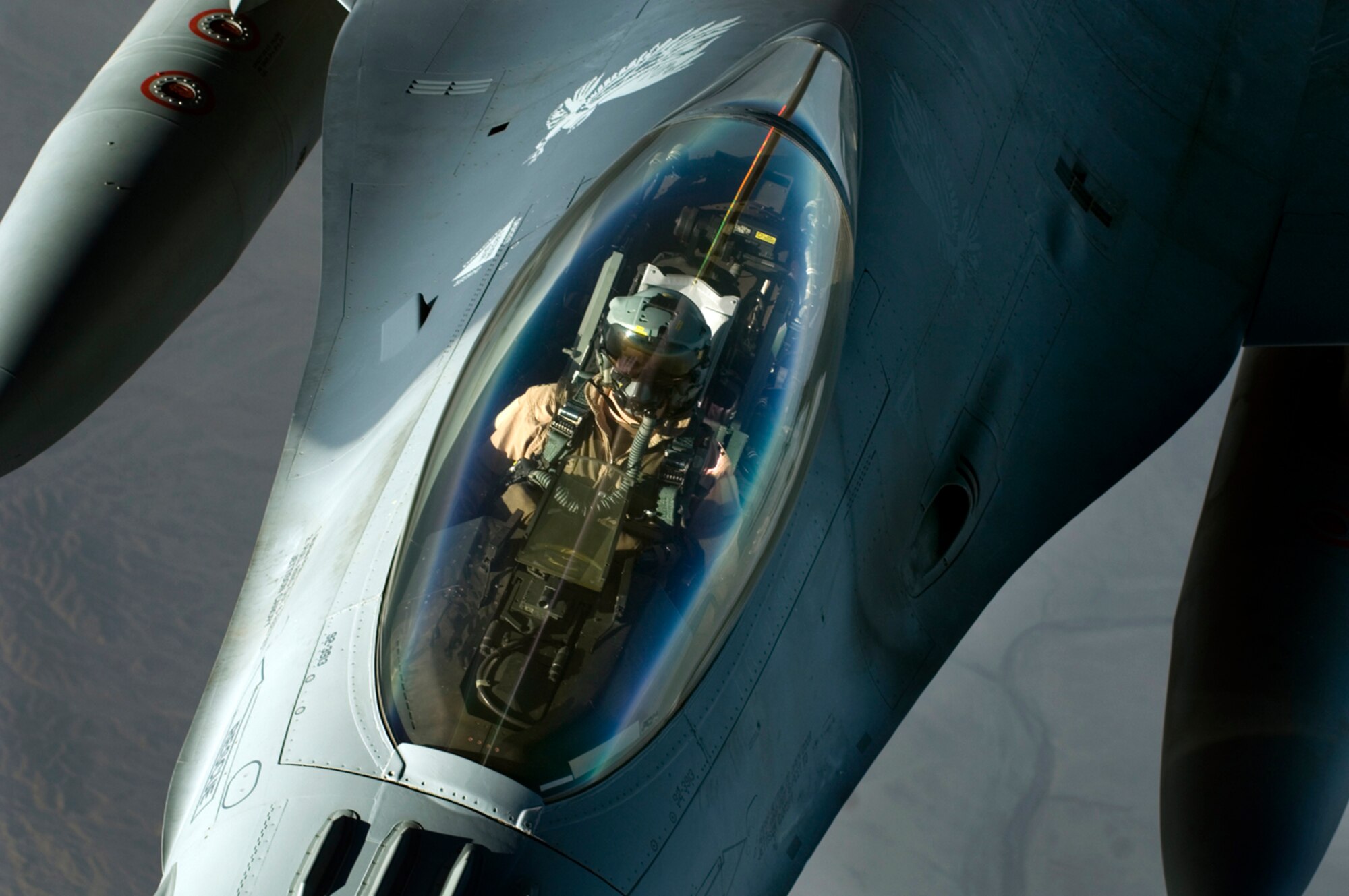 A F-16 Fighting Falcon detaches from a KC-135 Stratotanker after refueling over Iraq in support of Operation Iraqi Freedom. On Jan. 29, U.S., French and Royal Air Force tankers flew 25 sorties and off-loaded almost 1.6 million pounds of fuel in support of OIF and Operation Enduring Freedom. (U.S. Air Force photo/Tech. Sgt. Cecilio M. Ricardo Jr.) 