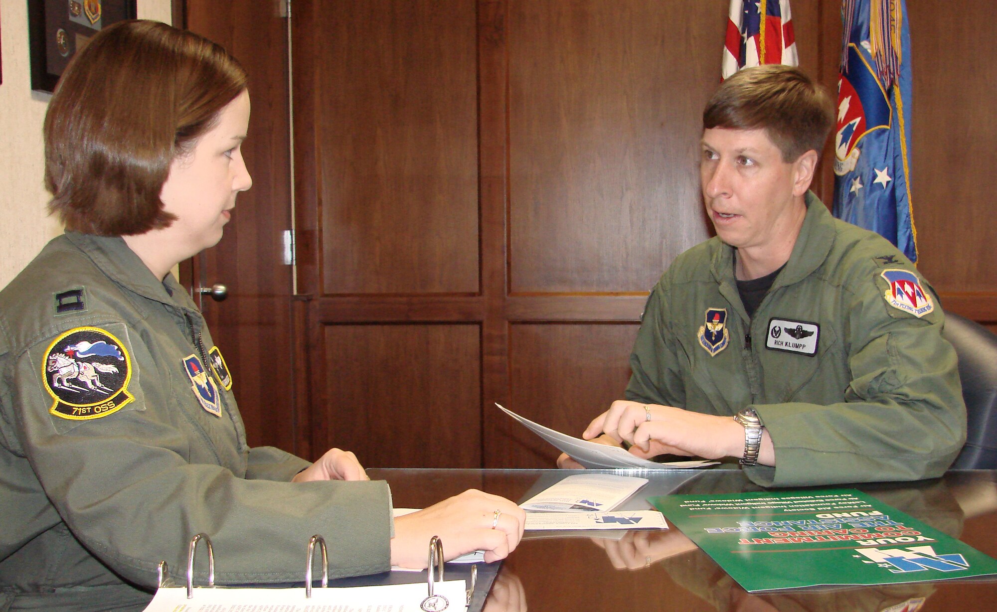 Capt. Karrina DeGarmo, 71st Operations Support Squadron and Col. Richard Klumpp, Jr., 71st Flying Training Wing commander, go over plans for the 2007Air Force Assistance Fund campaign at Vance Air Force Base. Captain DeGarmo is this wing project officer for this year's campaign from Feb.15 to March 28 on Vance. (Photo by Frank McIntyre)         