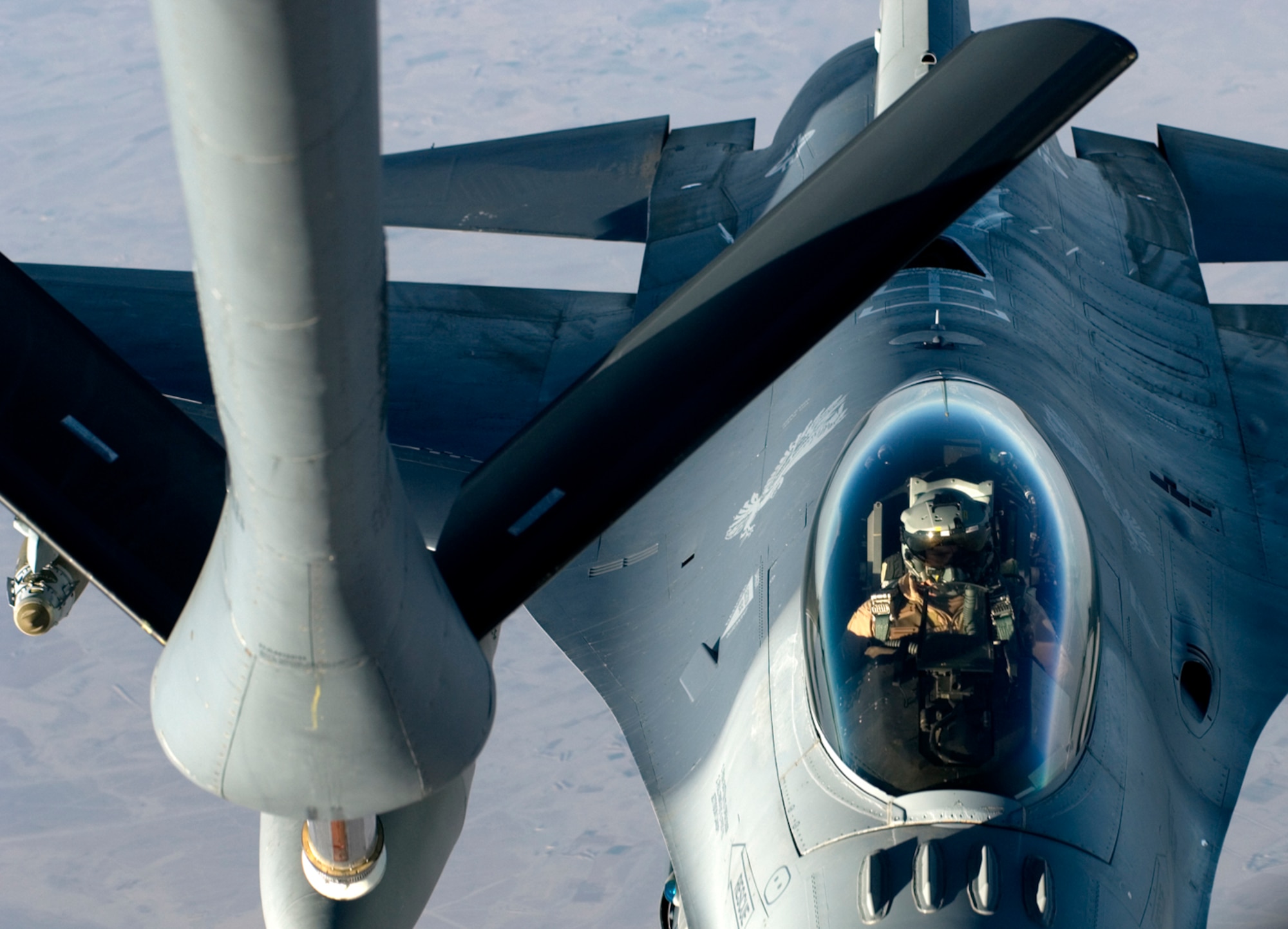 An F-16 Fighting Falcon refuels from a KC-135 Stratotanker over Iraq in support of Operation Iraqi Freedom. On May 18, U.S. Air Force, Royal Air Force, French Air Force and Republic of Singapore Air Force aerial refueling crews flew 48 sorties and off-loaded approximately 2.9 million pounds of fuel to 234 receiving aircraft. (U.S. Air Force photo/Tech. Sgt. Cecilio M. Ricardo Jr.) 
