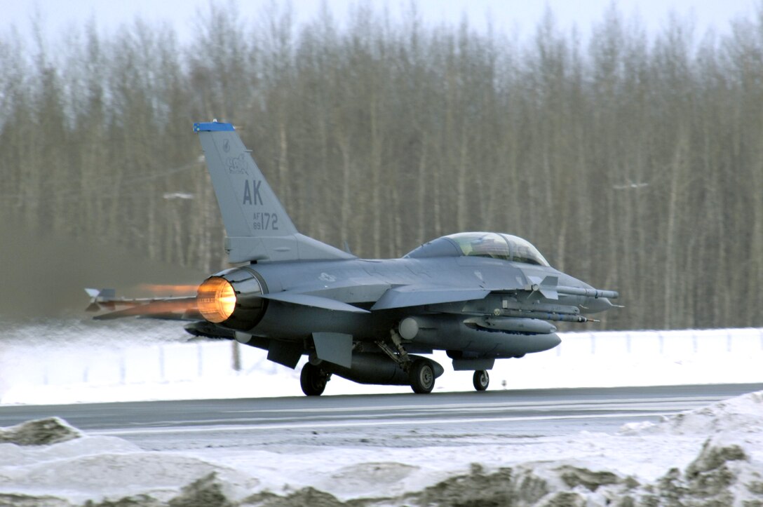 An F-16 Fighting Falcon takes off Feb. 8 at Eielson Air Force Base, Alaska. The 18th Fighter Squadron conducts air operations for combat-ready F-16 aircraft and provides close air support, forward air control, battlefield air interdiction, and offensive counter air. (U.S. Air Force photo/Staff Sgt Joshua Strang) 