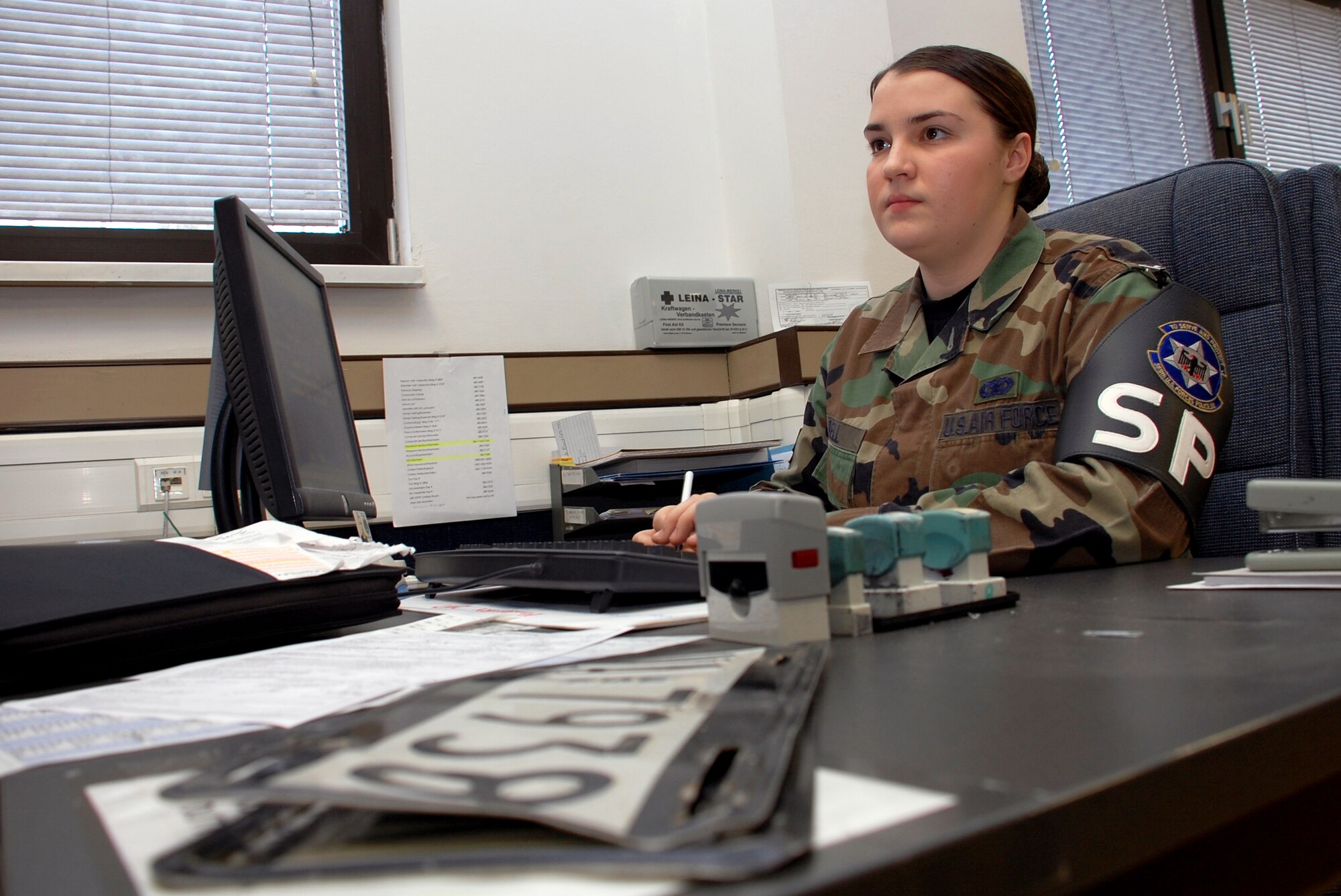Airman 1st Class Nicole Bell works in the vehicle registration office Feb. 1 on Kapaun Air Station, Germany. Members of the vehicle registration office realigned its workflow as part of an Air Force Smart Operations for the 21st century initiative to reduce customer waiting times. (U.S. Air Force photo/Staff Sgt. Dan Bellis)
