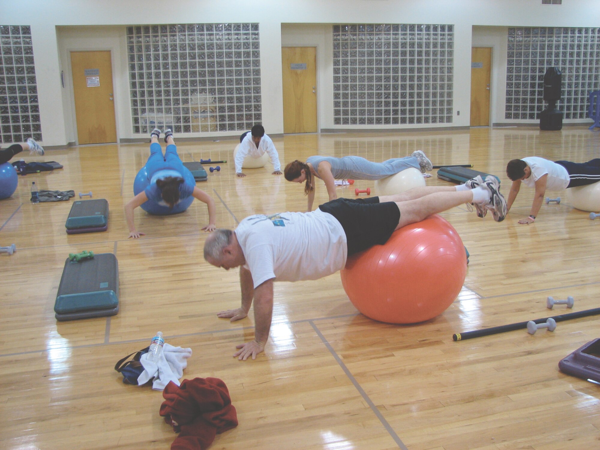 MCCHORD AIR FORCE BASE, Wash. -- The fitness readiness class does push-ups on balance balls at the fitness center annex  Feb. 5.
(U.S. Air Force Photo/Tyler Hemstreet)