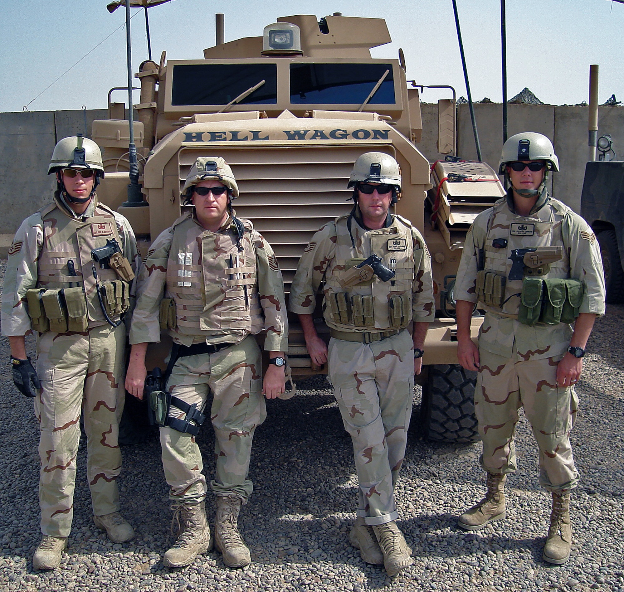 Staff Sgt. John Degnaro, Tech. Sgt. Sean Gray, Staff Sgt. Howie Loughran and Senior Airman Anthony Cerrone stand in front of an explosive ordnance disposal vehicle known as the Joint EOD Rapid Response Vehicle while deployed to Iraq. (Courtesy photo)                   