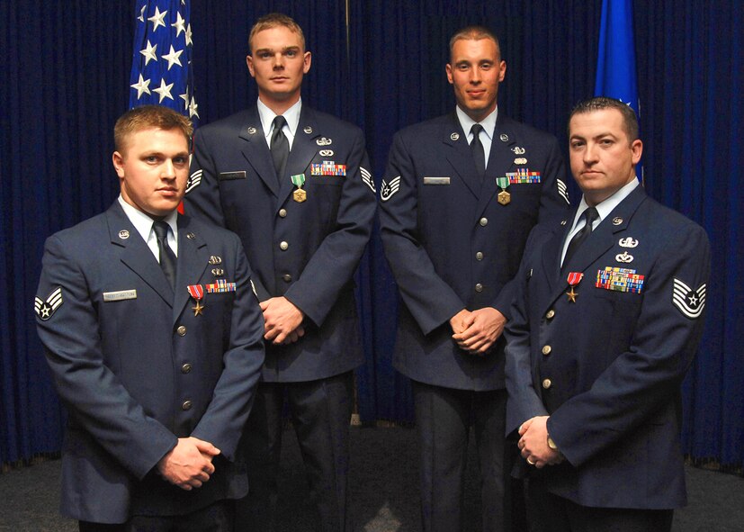 Left to right: Senior Airman Nicholas Worthington, recipient of a Bronze Star; Staff Sgt. Chris Jackson, recipient of an Army Commendation Medal; Staff Sgt. John Degnaro, recipient of an Army Commendation Medal; and Tech. Sgt. Sean Gray, recipient of a Bronze Star. (U.S. Air Force photo by Todd Berenger)