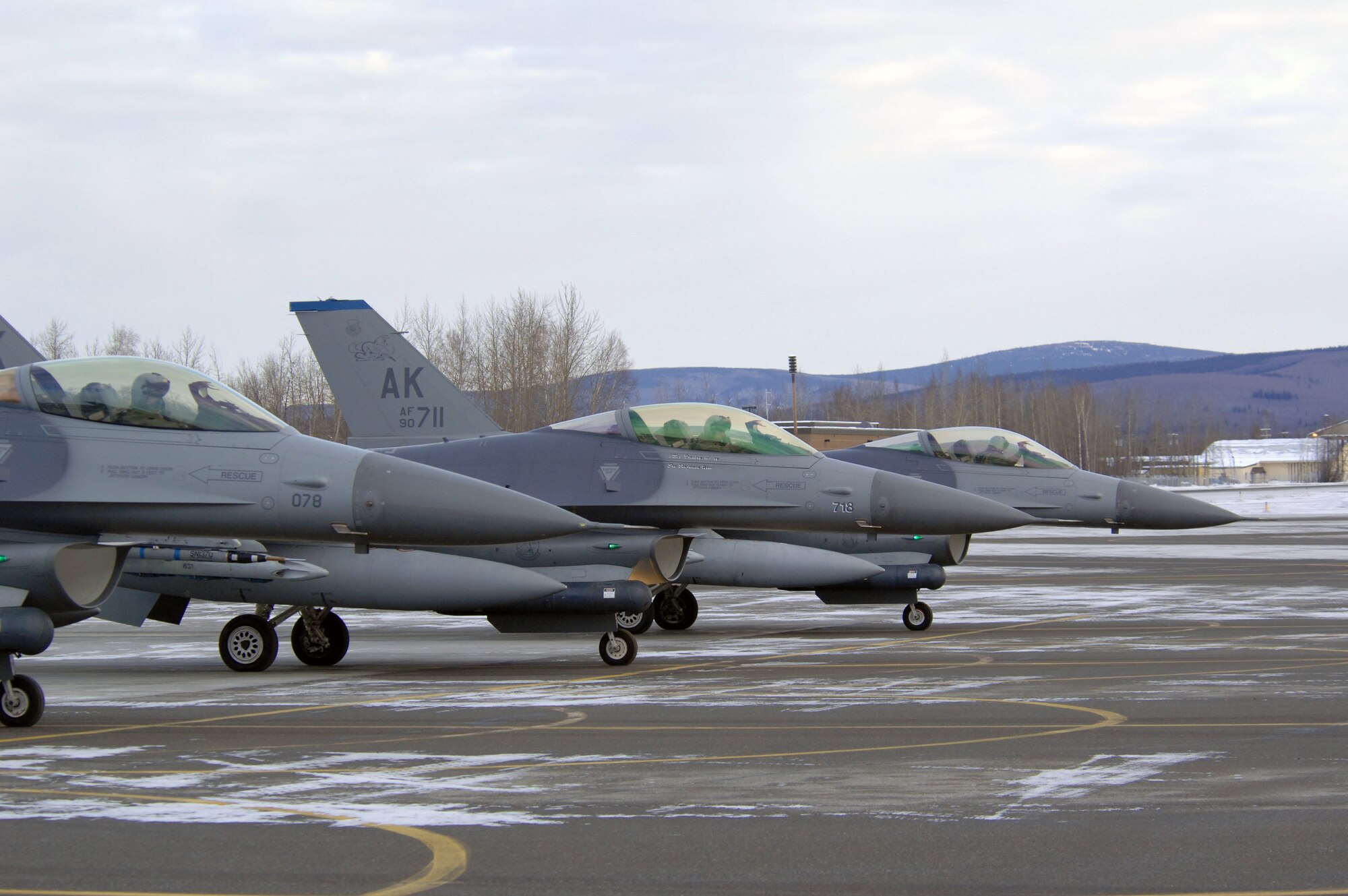 EIELSON AIR FORCE BASE, Alaska -- F-16 Fighting Falcon aircraft from the 18th Fighter Squadron sit on the flightline here prior to taking off for a training mission on Feb.8. The 18th Fighter Squadron conducts air operations for combat-ready F-16 aircraft and provides close air support, forward air control (airborne), battlefield air interdiction, and offensive counter air.
(U.S. Air Force Photo by Staff Sgt Joshua Strang)